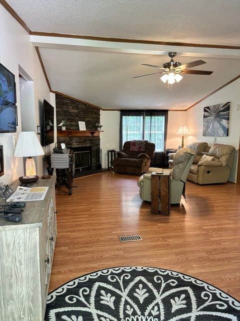 Country Roads ATV Retreat living room with 70-inch Roku TV — sleeps up to 10 guests