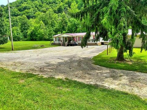 Front porch and 4-acre property at Country Roads ATV Retreat Delbarton West Virginia